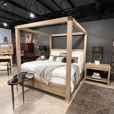 a bedroom with a bed, nightstands and other furniture in it's display area