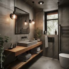 a bathroom with a sink, mirror and toilet