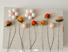 there are five flowers on the wall with different shapes and sizes in each flower head