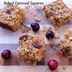 baked oatmeal squares with cherries are on a cutting board and ready to be eaten