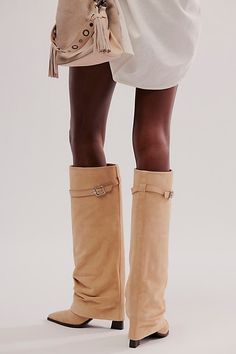 Stand out in these statement suede foldover boots, complete with flared overlays and buckle details for a pair that brings the drama. **Features:** Knee-high length, pull-on style, suede fabrication, slouchy flared overlay, buckle accent, pointed toe, chunky block heel **Why We | Felicity Foldover Boots by FP Collection at Free People in Tan, Size: US 7 Foldover Boots Outfit, Trendy Knee-high Suede Boots, Trendy Fitted Suede Knee-high Boots, Trendy Wide Calf Suede Knee-high Boots, Sand Suede Knee High Boots, Slouchy Boots Outfit, Western Suede Wide-calf Knee-high Boots, Foldover Boots, Slouch Boots