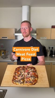 a man holding up a sign that says cannivore diet meat fast pizza