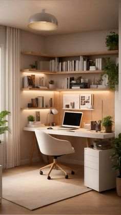 a white desk with a laptop on top of it in front of a bookshelf