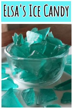 a glass bowl filled with ice candy on top of a table