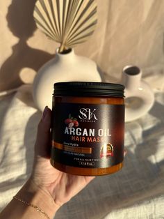 The S&K ENVISION Moroccan Argan oil infused hair therapy hair mask is formulated specially to heal, thicken and rehydrate your strands. The hair mask is made from a unique blend of natural organic ingredients and is sulfate-free, paraben-free, non-GMO (Genetically Modified Organisms), cruelty-free & vegan. They are formulated after years of research & testing to give our customers the best in hair therapy. BENEFITS: -Argan oil will make your hair shiny and smooth while also repairing damage to your dry scalp. It also gives a refreshing scent to your hair, keeping them fresh all day long. -100% NATURAL ORGANIC INGREDIENTS: Our Argan oil hair mask does not contain any silicones or mineral oils & are made from a blend of 100% natural ingredients, making it the best natural therapy for your ha Nourishing Hair Mask, Hair Mask Brands, Indian Gooseberry Hair Mask, Organic Hair Mask, Argan Oil Color, Silky Shiny Hair, Argan Oil Hair Mask, Argan Oil Shampoo, Hair Regrowth Treatments