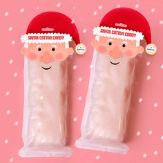 there are two candy bags with santa hats on them