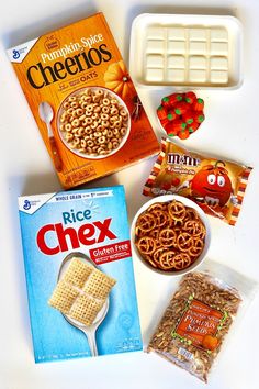 cereal, rice krispy bars, and other snacks are laid out on a table