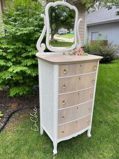 an old dresser with a mirror on top