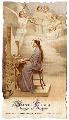 an angel playing the harp in front of angels