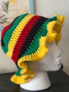 a crocheted hat on top of a white mannequin head