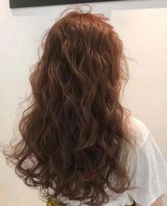 the back of a woman's head with long hair