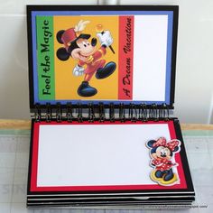 a mickey mouse note pad and pen holder