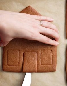 someone is making ginger cookies with icing on the table