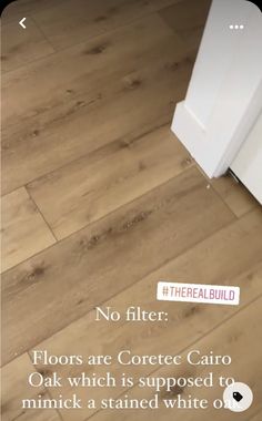 a white refrigerator freezer sitting on top of a wooden floor