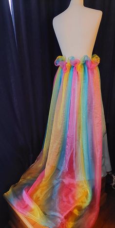 Perfect to finish off your alternative outfit, this handmade blue skirt with a frothy rainbow bustle skirt is ideal for anyone to be worn with pride!! layers of rainbow tulle sweeping out at the back designed to make a impact, finished with matching blue underskirt, laced up at the back for ease with matching ribbons.  waist to hem (back) 39 inches size UK 14. Rainbow Tulle Skirt, Bustle Skirt, Alternative Outfits, Blue Skirt, Women's Costumes, Tulle Skirt, Favorite Outfit, Lace Up, Rainbow