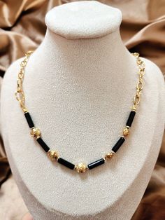 This Black Onyx necklace/Black and gold necklace/Gold rose and black onyx necklace/Black gemstone/Black chain necklace looks so unique. It is made with 4X13mm black Onyx round tube beads. The rose beads and all other metal parts, including the chain, and the lobster claw clasp, are all 18k gold (vacuum-plated on stainless steel), which is tarnish-resistant and skin-friendly. If you want to learn more about vacuum plating technique and stainless steel (vs. sterling silver), please read the third Luxury Gold Beaded Necklace With Black Beads, Luxury Black Necklaces With Gold Beads, Gold And Black Bead Necklace, Luxury Black Jewelry With Gold Beads, Black Beads Chain, Black And Gold Necklace, Black Stone Necklace, Black Chain Necklace, Rose Beads