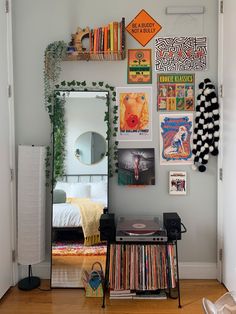 a room with various records and posters on the wall