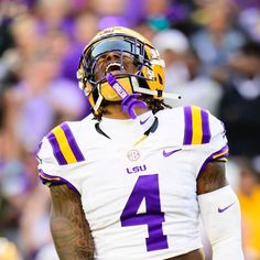 a football player wearing a helmet on the field