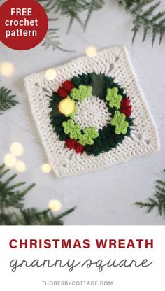 a crochet christmas wreath ornament hanging from a tree