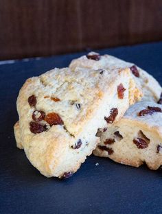 three cookies with raisins are stacked on top of each other