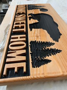 a wooden sign with the words minnesota carved into it's sides on a table