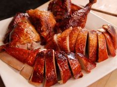 sliced meat and vegetables on a white plate