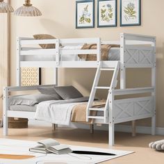 a white bunk bed sitting in a bedroom next to a wall with pictures on it