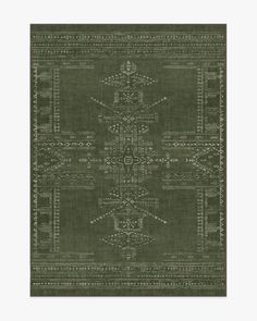 a green rug with an intricate design on the front and back side, in shades of gray