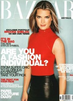 a magazine cover with a woman in a red top and black skirt on the cover