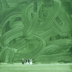 three people are standing in front of a green painting that looks like an abstract pattern