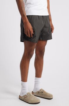 Get active and stay comfortable in these comfortably lightweight shorts ideal for the gym, sport court or a jog along the beach. Elastic/drawstring waist Front slant pockets Lined 100% ECONYL® regenerated nylon ECONYL regenerated nylon is made with recovered nylon waste, such as fishing nets and fabric scraps Machine wash, tumble dry Imported Casual Sports Swimwear With Built-in Shorts, Relaxed Fit Nylon Gym Bottoms, Sporty Short Leg Beach Bottoms, Sporty Beach Bottoms With Short Legs, Casual Training Bottoms With Drawstring, Casual Sports Swimwear With Short Legs, Casual Athletic Shorts For Training With Elastic Waistband, Casual Athletic Shorts With Elastic Waistband For Training, Athleisure Bottoms With Drawstring For Training