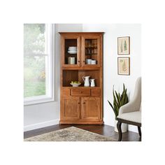 a wooden cabinet sitting in front of a window