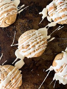 cookies with icing and chocolate chips on a baking sheet