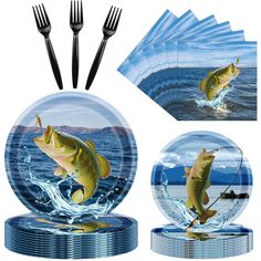 two plates with fish on them and forks next to each other in front of an image of a fishing scene