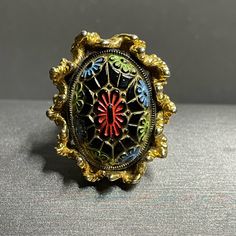 This Vintage Ring Boasts A Unique Moroccan Glass Cabochon With A Stunning Multicolor Design, Set In A Gold Tone Adjustable Band Adorned With Delicate Leaves. The Ring Is Perfect For Those With A Love For Estate Jewelry And Unique Pieces That Stand Out. It Is A Size 7 And Would Make A Great Addition To Any Jewelry Collection. The Band Material And Metal Are Unknown, Adding To The Intrigue Of This One-Of-A-Kind Piece. Moroccan Glass Lg Cabochon Gold Tone Leaves Vintage Adjustable Ring Sz 7 Leaves Vintage, Design Set, Vintage Ring, Adjustable Ring, Womens Jewelry Rings, Adjustable Rings, Estate Jewelry, A Love, Vintage Rings