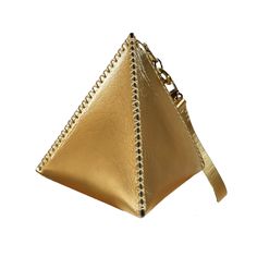 Concept: The TETRA wristlet, a geometric mini bag that makes a maximum style statement. Inspired by the tetrahedron, one of the five perfect Platonic solids, this purse combines striking shape with lightweight utility. Crafted from supple Italian leather, the bag's four triangular panels join together to create a sleek triangle pyramid silhouette. The unexpected shape prompts intriguing questions, let the Tetra wristlet add an element of drama, intrigue and mathematical marvel to your ensemble. Numerology 6, Elements Of Drama, Platonic Solids, Creative Jewelry Photography, Platonic Solid, Triangle Bag, Greek Philosophers, Modern Accessories, Jewelry Photography