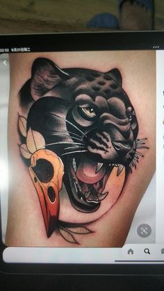 a black panther with a skull on it's leg is shown in this tattoo design