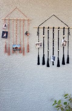 a wall hanging with pictures and tassels on it