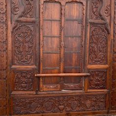 an old wooden door with carvings on it