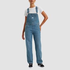 These Vintage Denim Overalls have all the familiar features you love that create an authentic look from top to bottom. Better with age and wear, this classic workwear essential has already become our closet staple to transition through the seasons. In 1873, Levi's ® invented the blue jean. What started as a piece of clothing for the American worker quickly became an icon of American style around the globe. And every Levi's ® style is crafted with the same high standard of craftsmanship and quali Levi’s Overalls Outfit, Levi's Denim Overall Jumpsuit, Levi’s Overalls, Medium Wash Full-length Overalls With Pockets, Cardigan Fits, Classic Workwear, Non-stretch Blue Denim Overalls, Vintage Overalls, Tube Jumpsuit