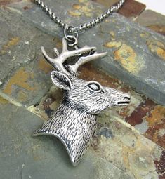 "Pendant Featured: Deer Head Pendant, Antique Silver Tone Alloy, 51x43x6mm (2\" x 1 5/8\" x 1/4\" approx) STAINLESS STEEL CHAINS - Hypo Allergenic, Resist Tarnishing Flat Link Chain, 4 x 3mm, Stainless Steel Chain, Lobster Clasp Twist Curb Chain, 4.6 x 3.3 x 0.6mm, Stainless Steel Chain, Lobster Clasp Ball Chain, 2.4mm, Stainless Steel Chain, Ball Connector Rolo Chain, 3 x 1mm, Stainless Steel Chain, Lobster Clasp Please select necklace style and length from the drop down lists or select custom Peace Sign Necklace, Brown Jewelry, Necklace Antique, Moon Pendant Necklace, Hippie Necklace, Deer Head, Men's Necklace, Rolo Chain, Star Pendant