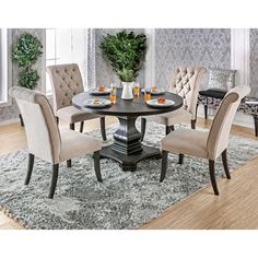 a dining room table with chairs around it