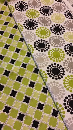 a green and black table cloth with circles on it