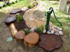 a green hose is connected to a tree stump