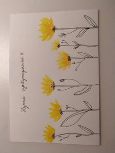 a white card with yellow flowers on it