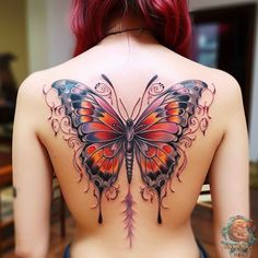 the back of a woman's body with a butterfly tattoo on her upper half