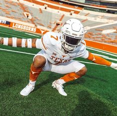 a football player kneeling down on the field