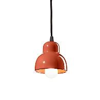 an orange pendant light hanging from a ceiling