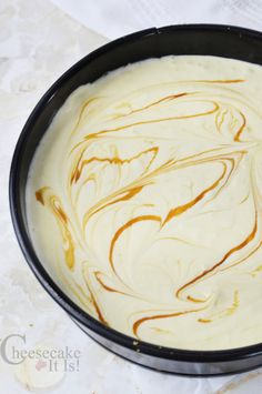 a pan filled with batter sitting on top of a table