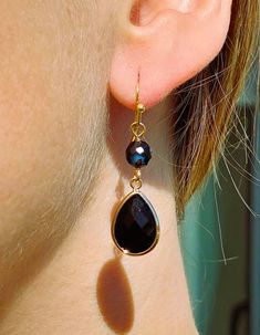 Long earrings made with a 5 mm black Obsidian bead. and with a faceted black Obsidian teardrop bead with a gold plated frame. The hooks are stainless steel and hypoallergenic gold plated. Matching necklace: https://www.etsy.com/en/listing/1178892670/black-spinel-pendant-choker?click_key=3ce6aa27fb3b1a9435d69b51a520228c097816fb%3A1178892670&click_sum=2b6242d4&ref=shop_home_feat_2 💎M A T E R I A L E S The semi-precious Obsidian stone and metals used for the earrings are selected from a trusted su Obsidian Stone, Pendant Choker, Earrings Elegant, Teardrop Beads, Black Spinel, Black Obsidian, Earrings Black, Earrings Long, Black Earrings